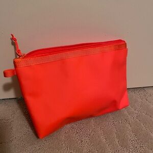 Baboon to the Moon orange pouch